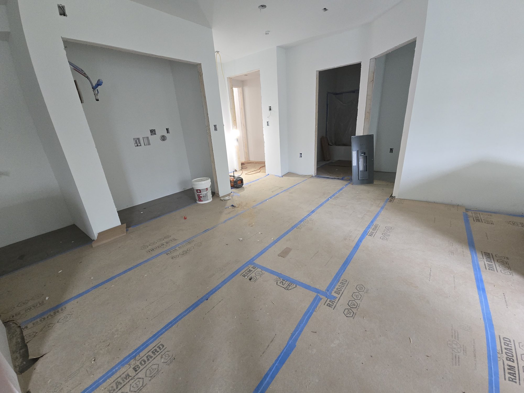 Finished drywall inside an apartment with floor protection down